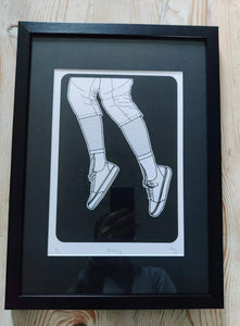 Framed Elegance: Woman's Feet Falling Through Space - Limited Edition Print with Black Mat
