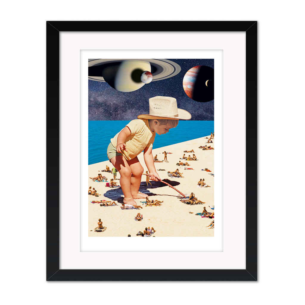 On the beach collage mounted giclee print in black frame with white mount, featuring a surreal beach scene with an oversized child and celestial elements