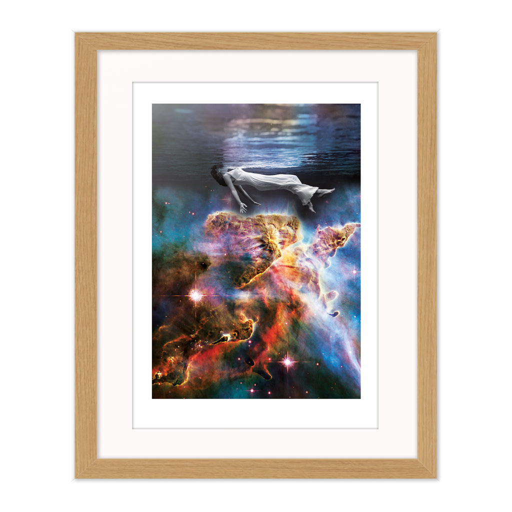 Sleep collage mounted giclee print in natural wood frame with white mount, showing a floating figure and cosmic imagery exploring rest and stillness