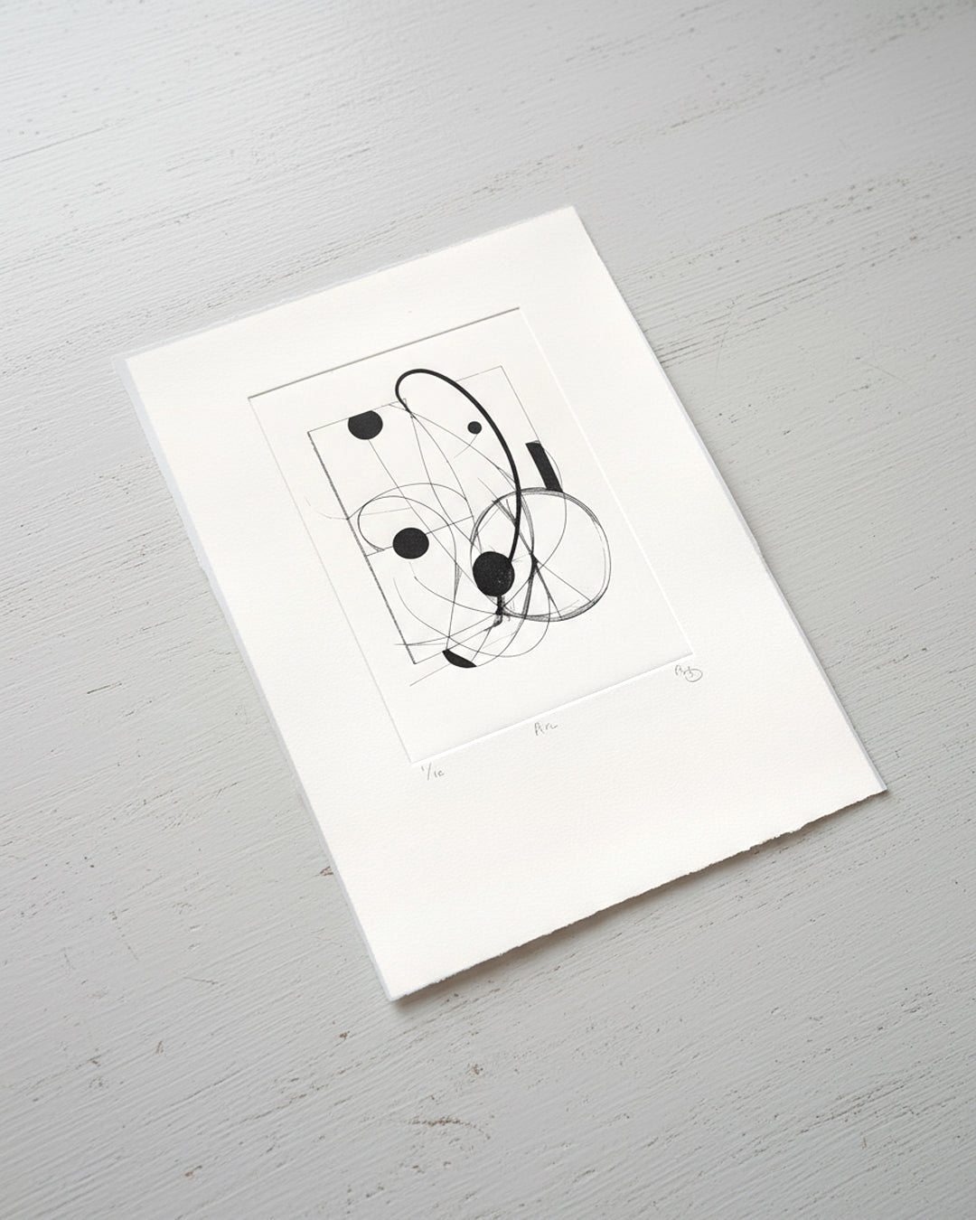 Arc artwork by Gerard McDonagh, showing abstract curved lines and black circular forms, shown on paper.