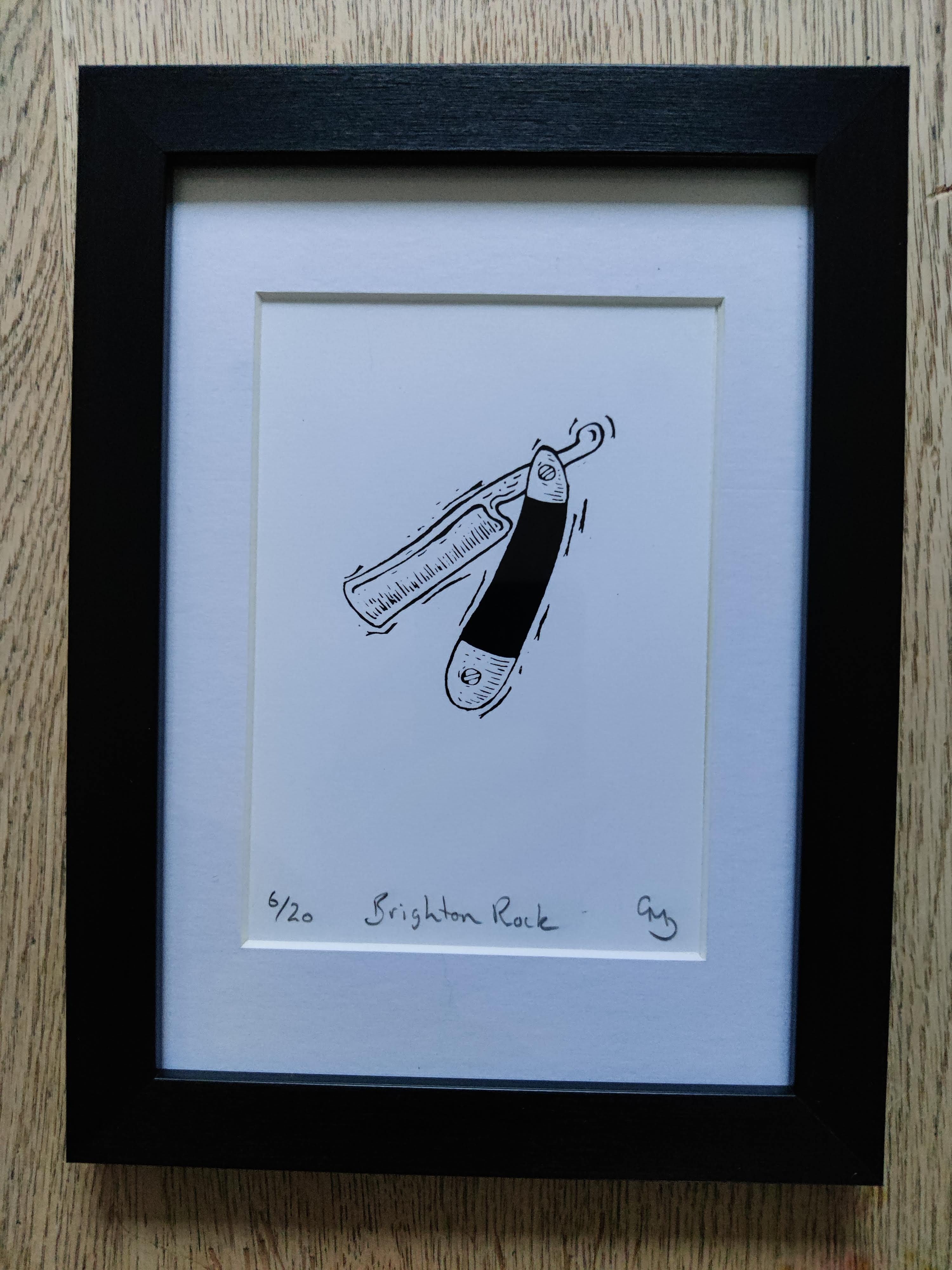 Framed 'Brighton Rock' silk screen print - a contemporary masterpiece.